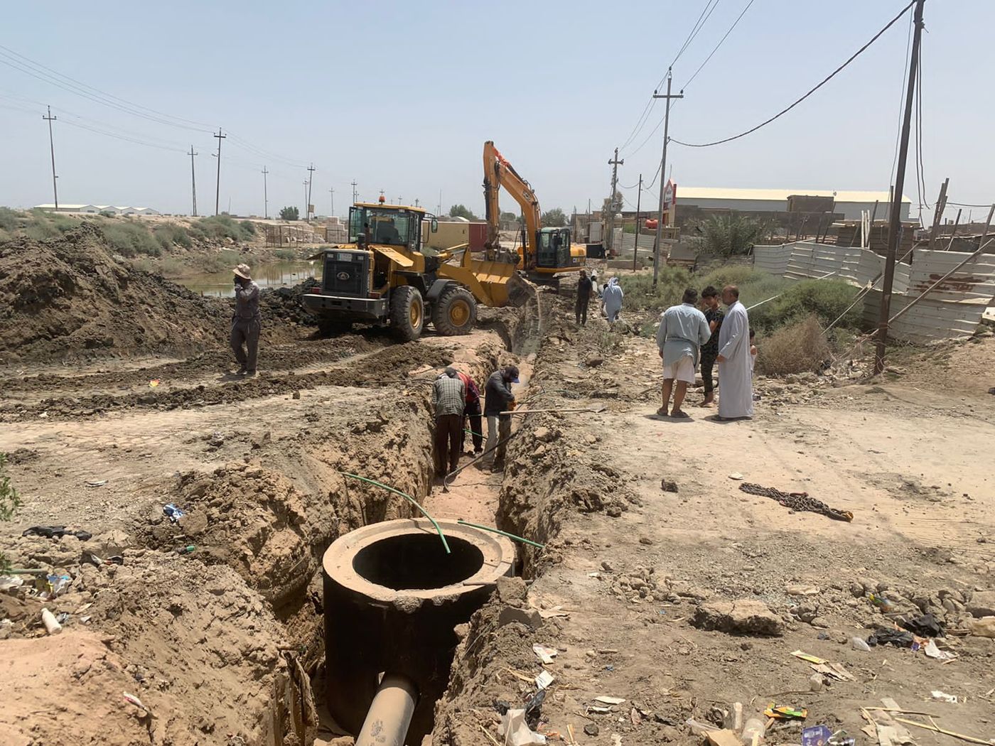 Sewage pipe trench installation in Al-Jibayish
