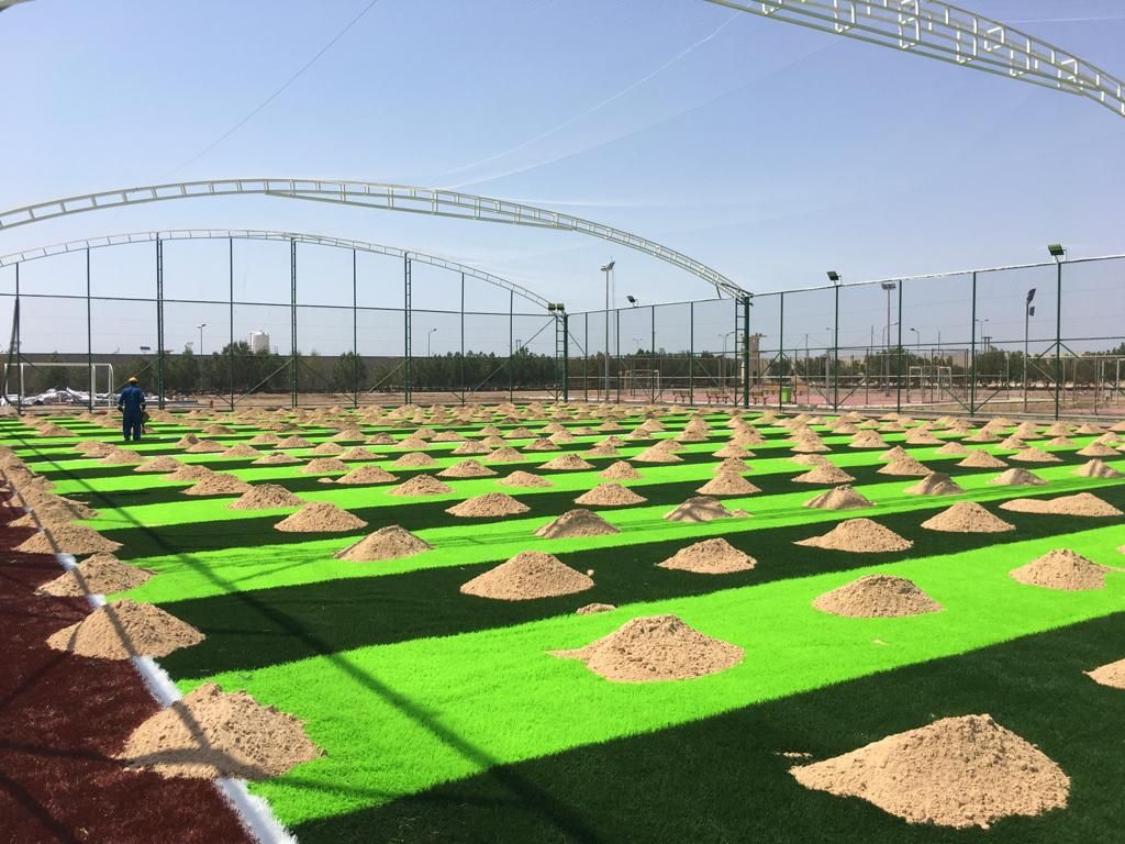 Artificial turf and sand infill installation for the Petronas football field